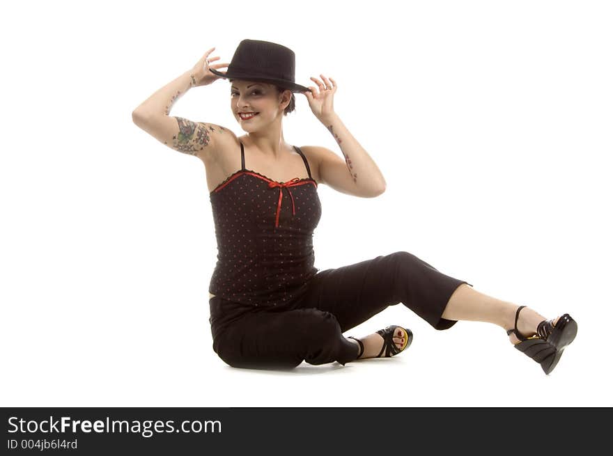 Woman in her thirties playing with a black hat. Woman in her thirties playing with a black hat