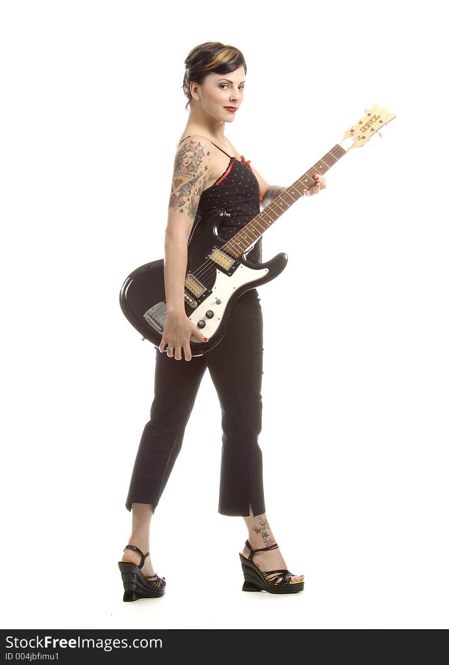 Woman in her thirties playing electric guitar. Woman in her thirties playing electric guitar