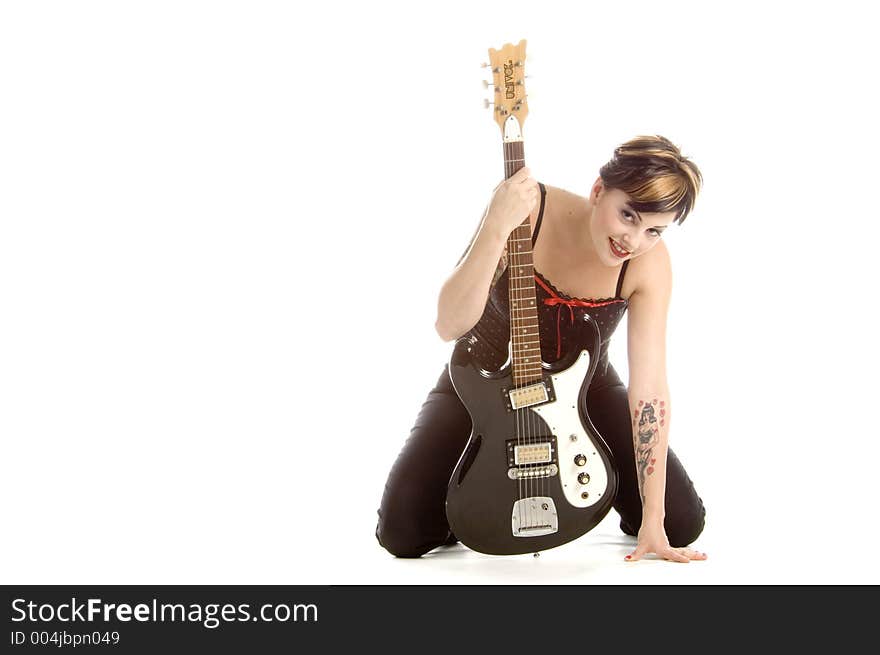 Woman in her thirties playing music on electric guitar. Woman in her thirties playing music on electric guitar