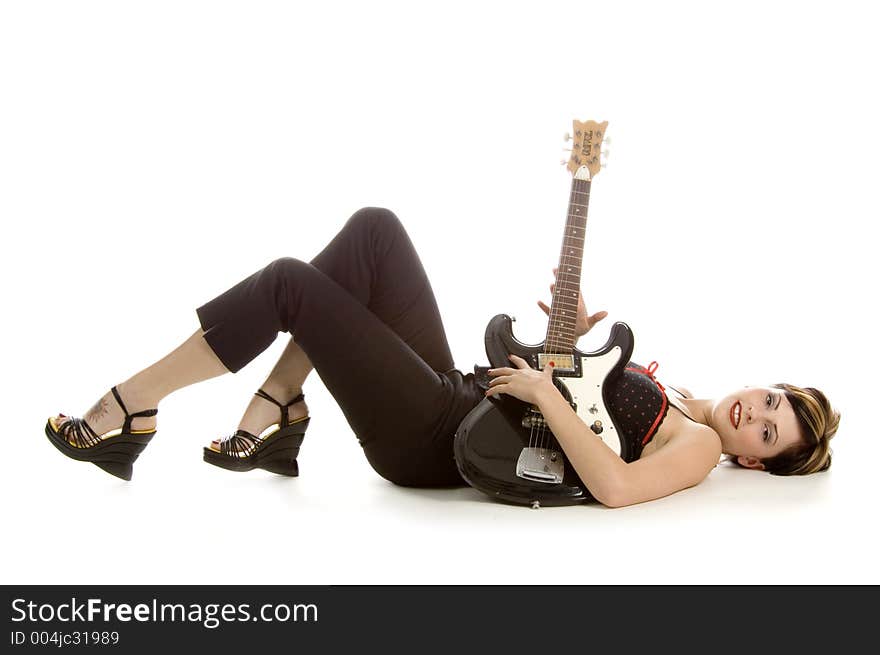 Woman in her thirties playing music on electric guitar. Woman in her thirties playing music on electric guitar