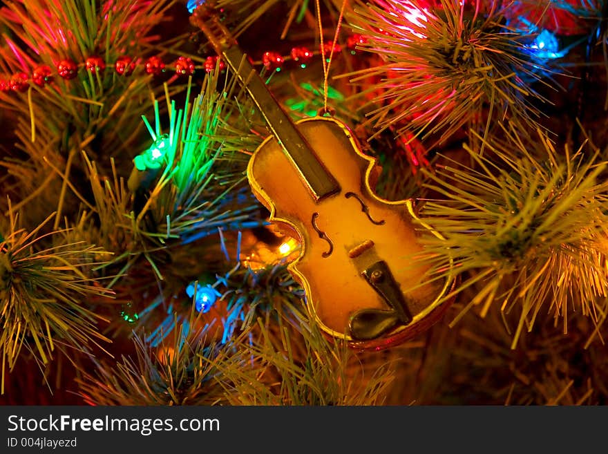 Christmas tree with violin ornament. Christmas tree with violin ornament