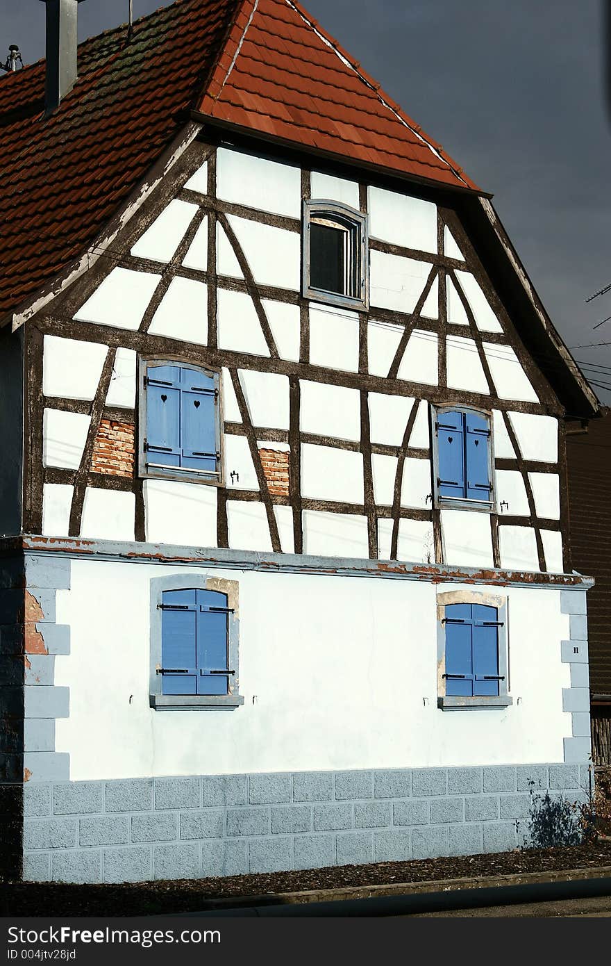 In the street of a alsacian villlage in the summer, half timbered traditional house. In the street of a alsacian villlage in the summer, half timbered traditional house