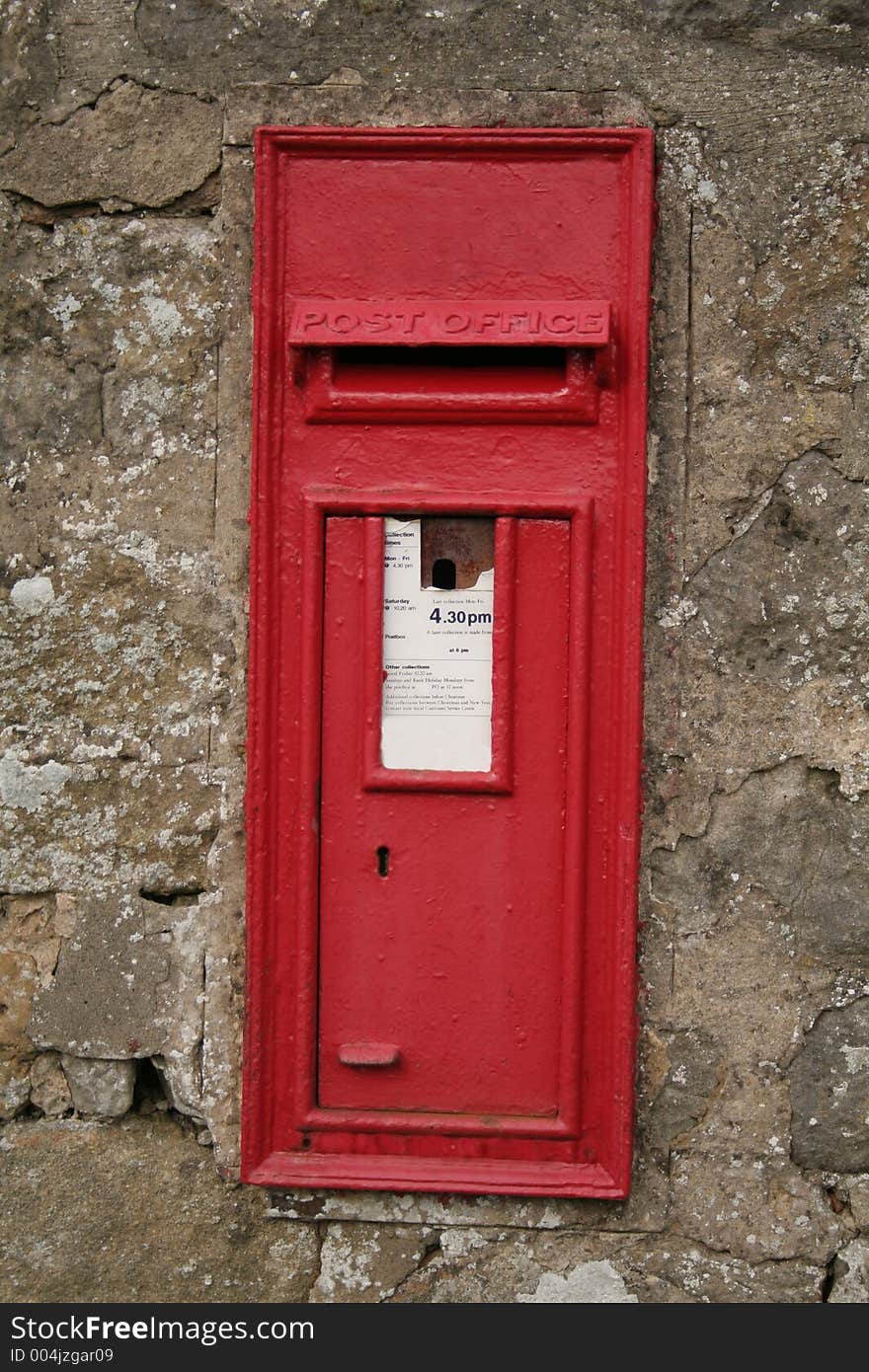 Red in the wall Victorian English post box which is still in use today. Red in the wall Victorian English post box which is still in use today