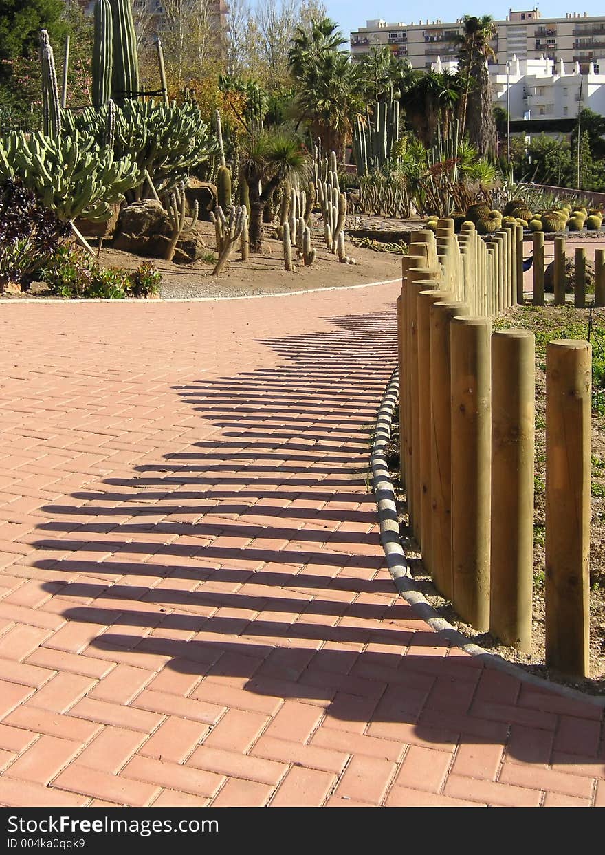 Abstract shadows off the fencing posts