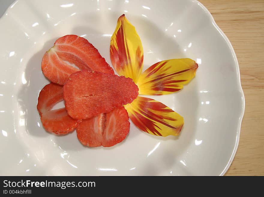 Sliced strawberry dessert with tulip decoration