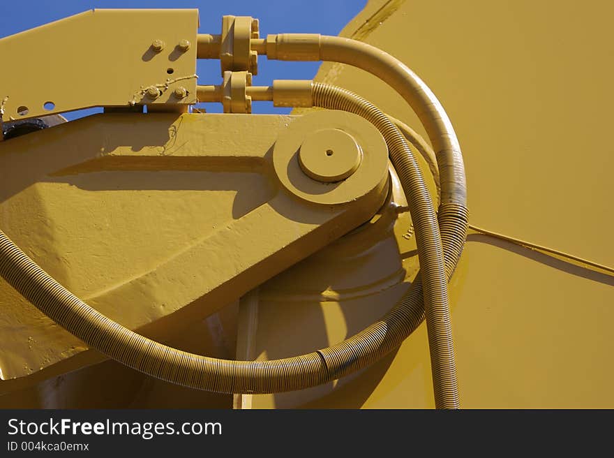 Excavator Detail with Blue Sky Background