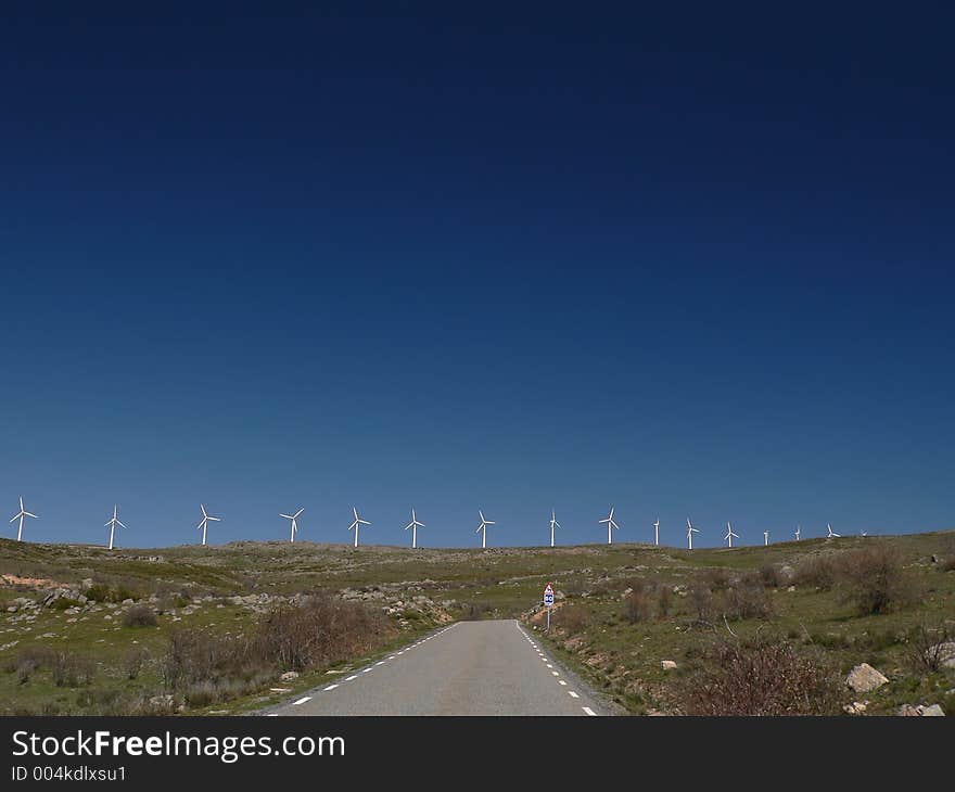 Line of Wind Turbines under Deep Blue Spanish Sky. Line of Wind Turbines under Deep Blue Spanish Sky