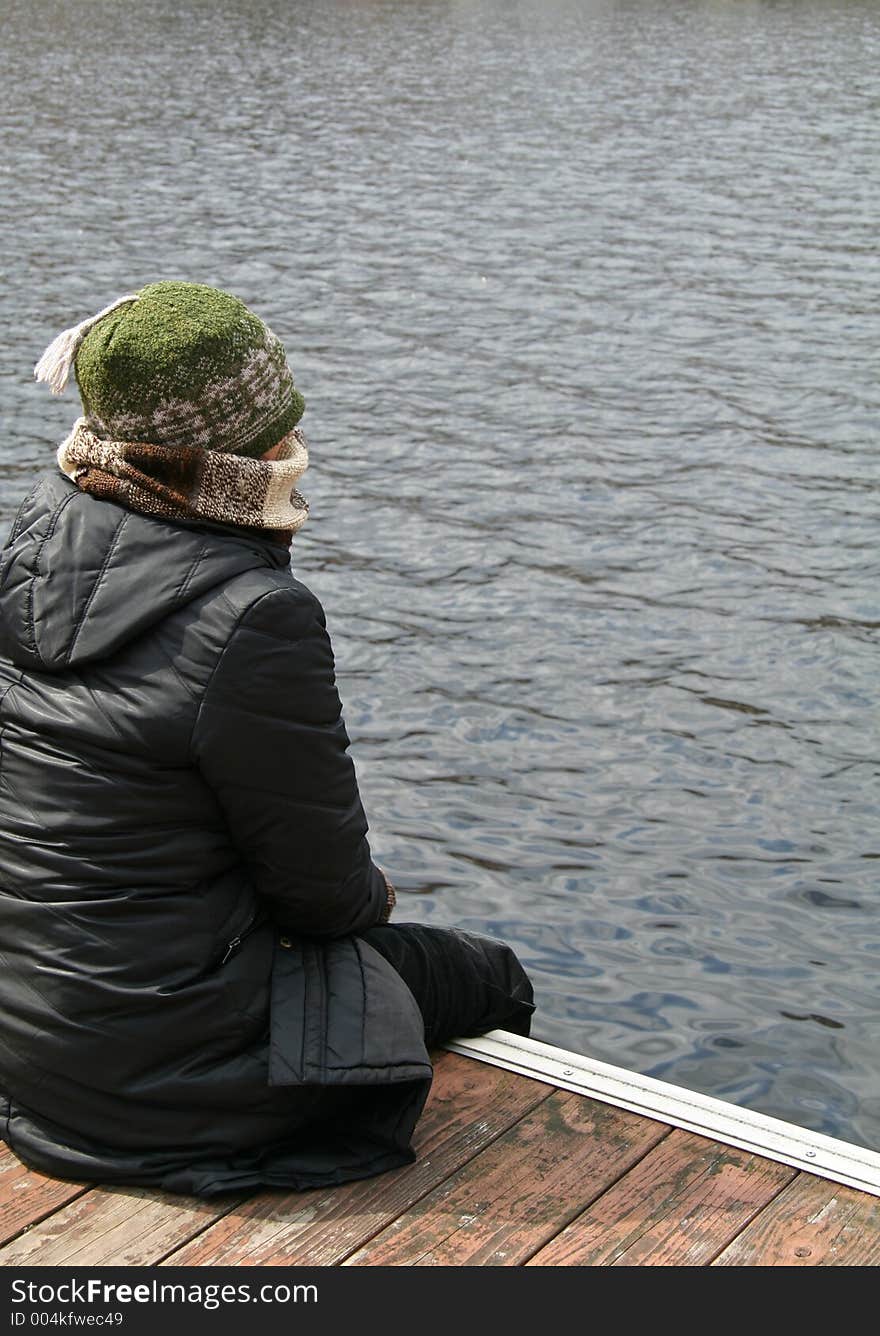 Bundled up woman by the lake