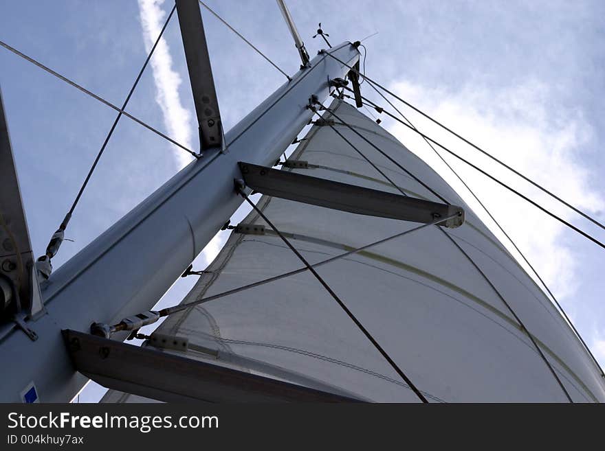 A view of the a salboat sail from the base of the mast. A view of the a salboat sail from the base of the mast