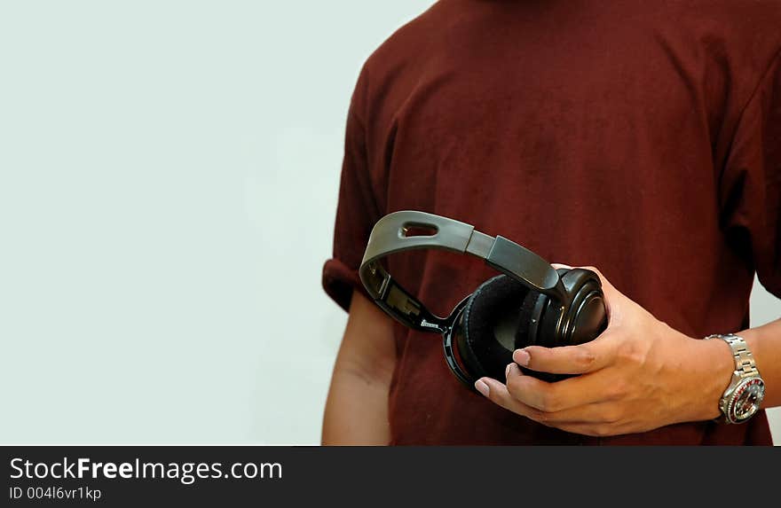 Closeup man holding earphone