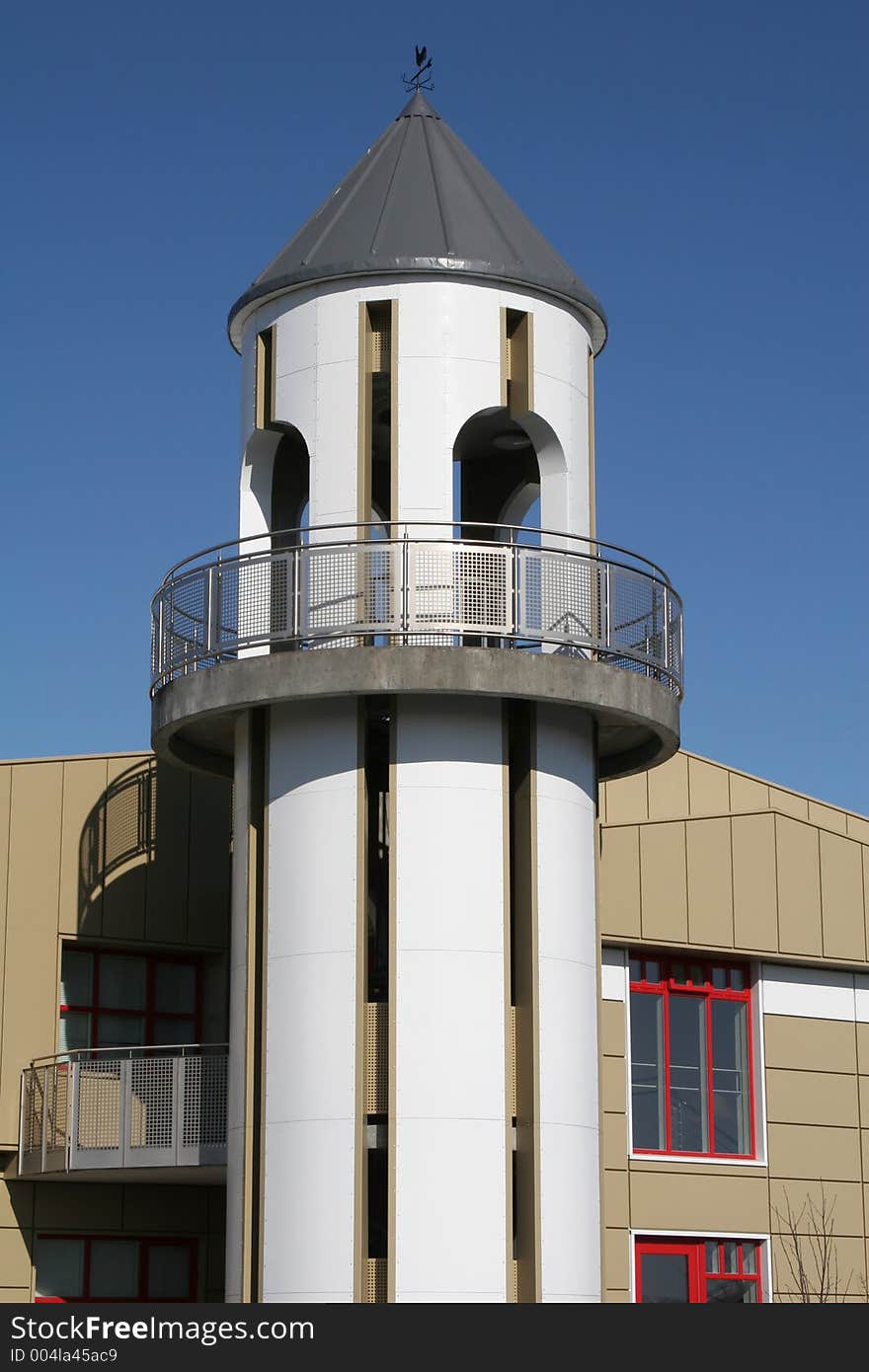 White lookout tower on a beige building. White lookout tower on a beige building