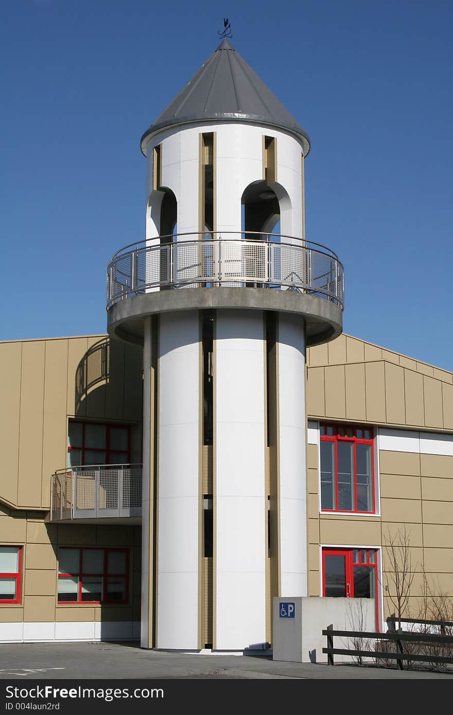 White tower on a modern beige colored building