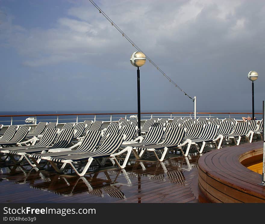 White And Blue Striped Deck Lounging Chairs