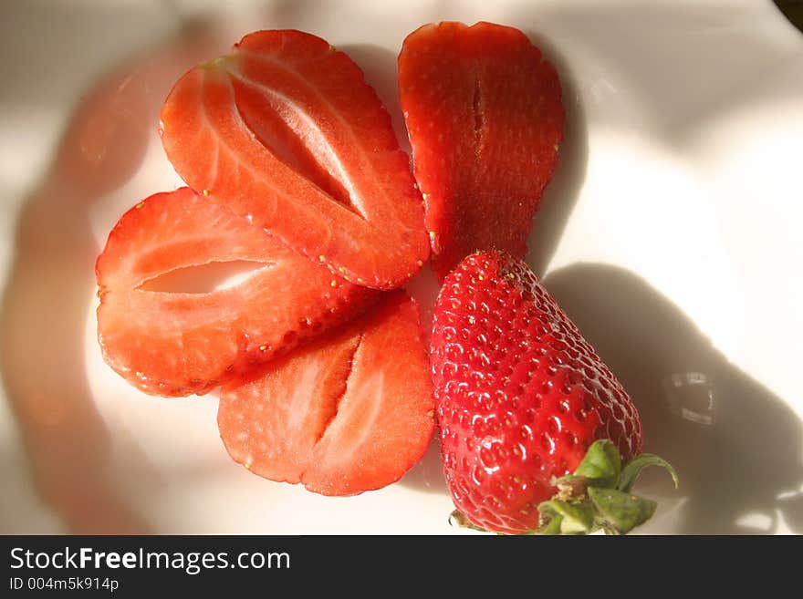 Strawberries in the sunshine eaten on a sunny day