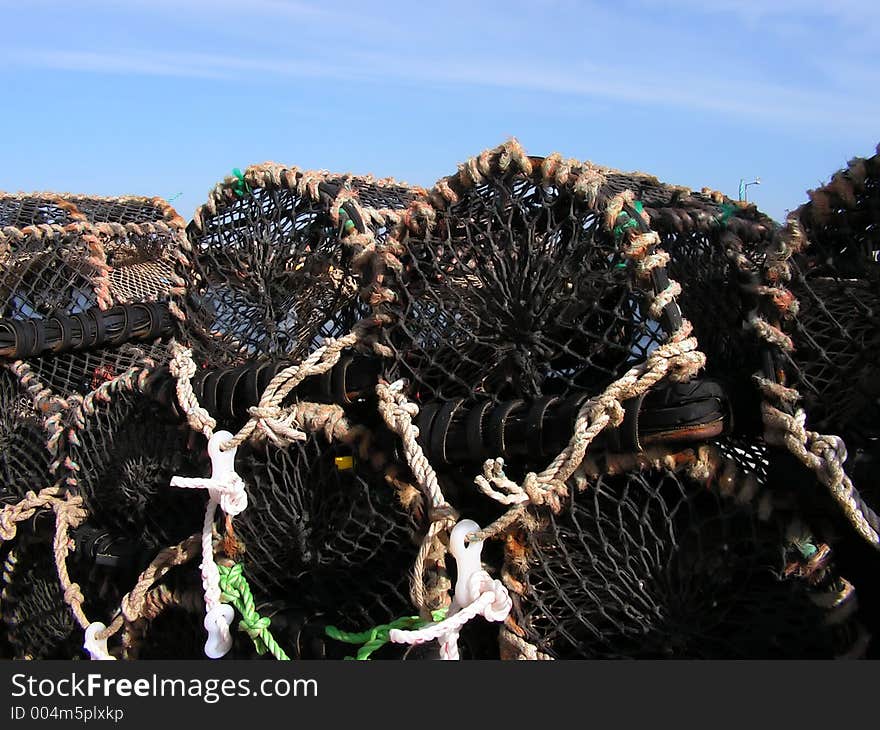 A close up of a cfew lobster / crab creel pots waiting to be taken to sea and laid out. A close up of a cfew lobster / crab creel pots waiting to be taken to sea and laid out.