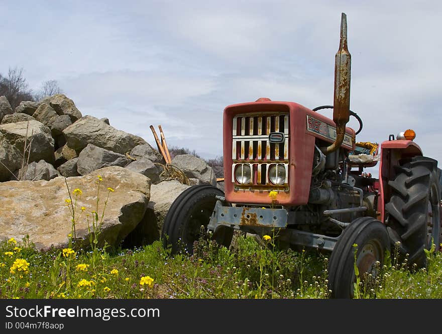 An decaying tractor in the Japanese countryside. An decaying tractor in the Japanese countryside.