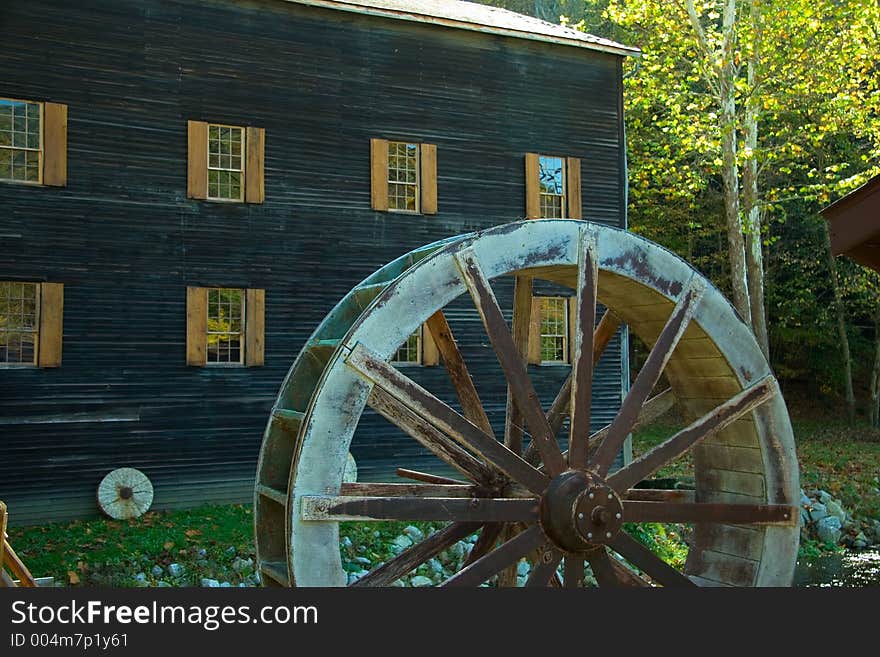 Water Wheel in front of an Amish Grist Mill. Water Wheel in front of an Amish Grist Mill