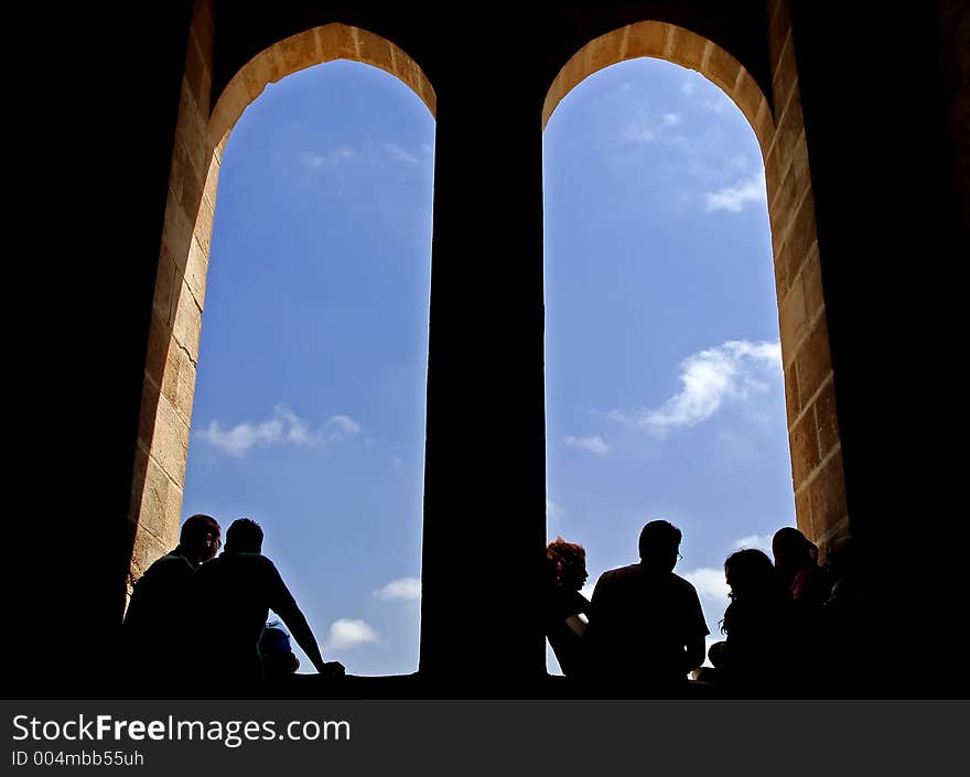 Silhouette of peoples and windows at a castle