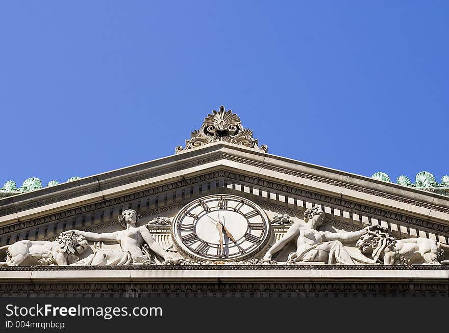 Old building attic with a street clock. Architectural details. Old building attic with a street clock. Architectural details.