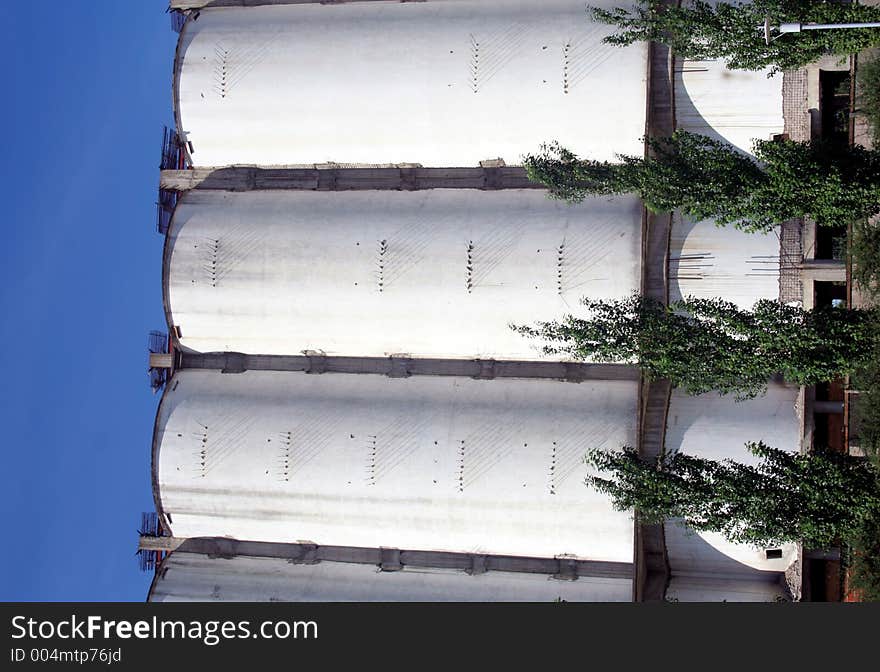 Three industrial storage tanks