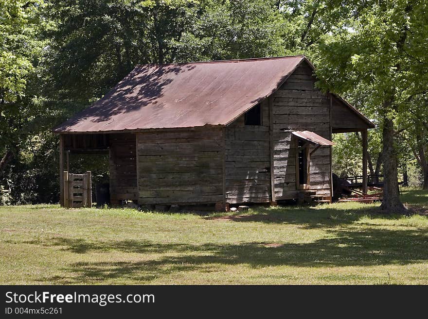 An old shed or barn in a clearing