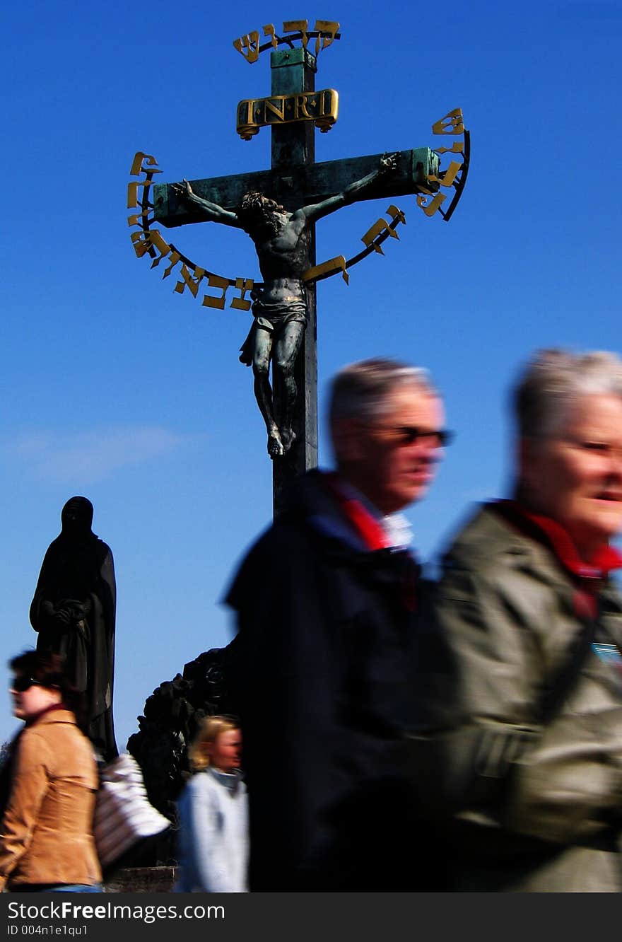 A cross statue on the Charles Bridge in Prague, Czech Republic. A cross statue on the Charles Bridge in Prague, Czech Republic.