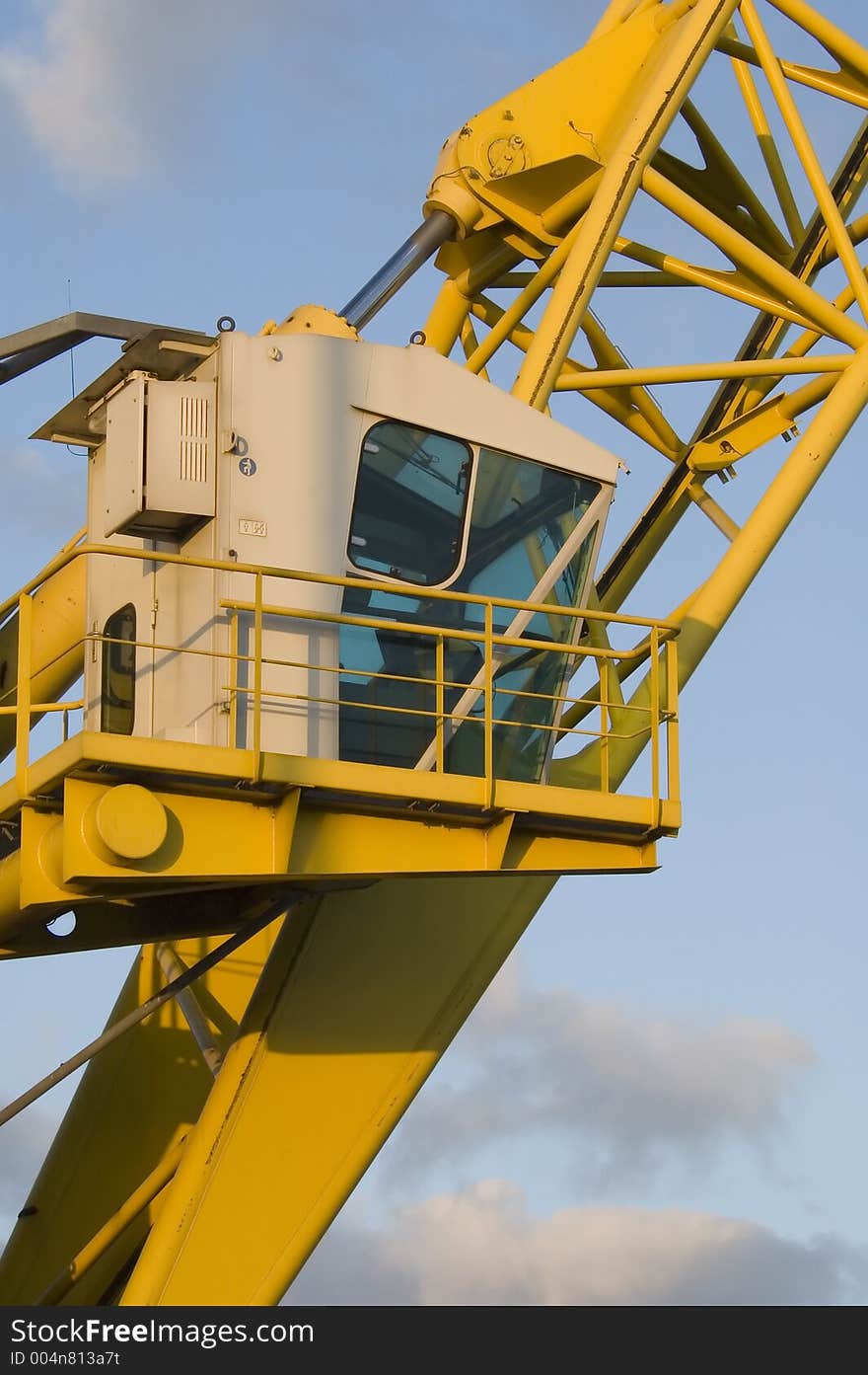 Yellow crane at the dockside