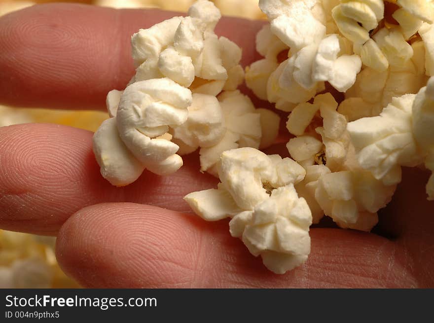 Popcorn in a working man's hand