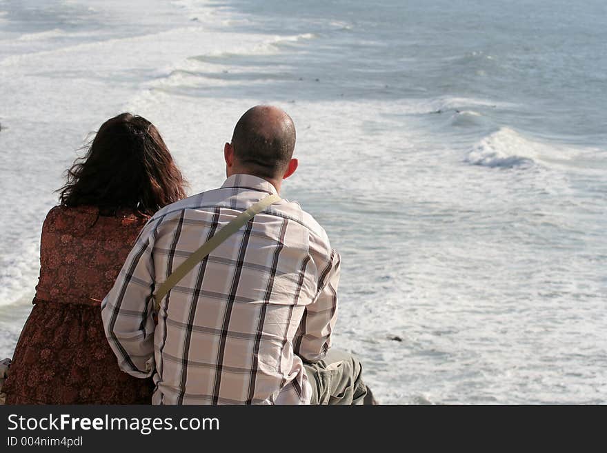 Couple watching the surf