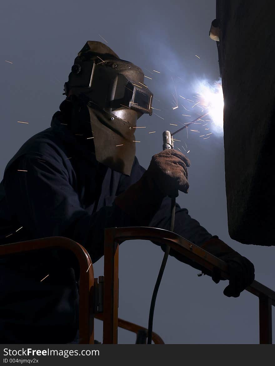 Worker welding at night. Worker welding at night