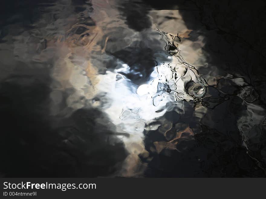 Reflection of sunny sky in water. Reflection of sunny sky in water