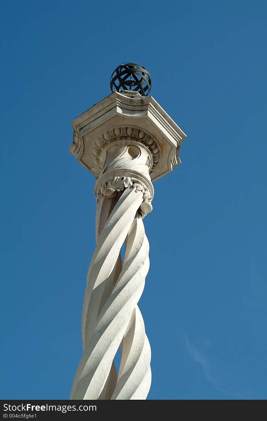 Beautiful medieval column in blue sky