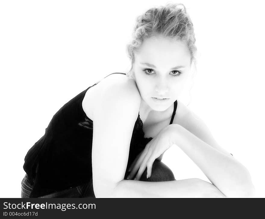 3/4 shot of blonde teen leaning on chair. 3/4 shot of blonde teen leaning on chair.