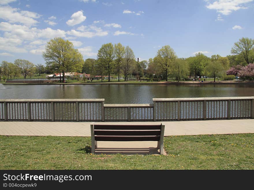 Empty bench at a NJ park lake. Empty bench at a NJ park lake