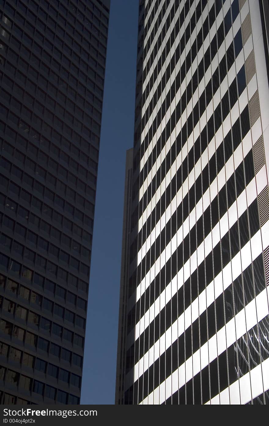 The canyon of glass and metal between two sky scrapers. The canyon of glass and metal between two sky scrapers.