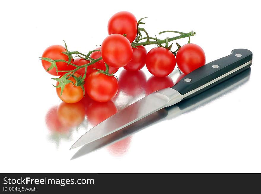 Tomatoes and knife. Look in profile for more