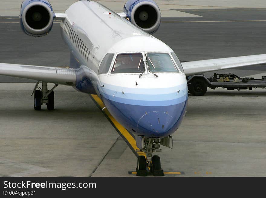 A commuter jet pulls up to the terminal at Newark international airport. A commuter jet pulls up to the terminal at Newark international airport.