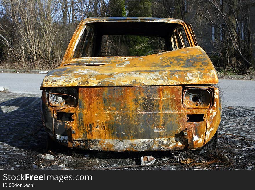 Burned car on the road side. Burned car on the road side