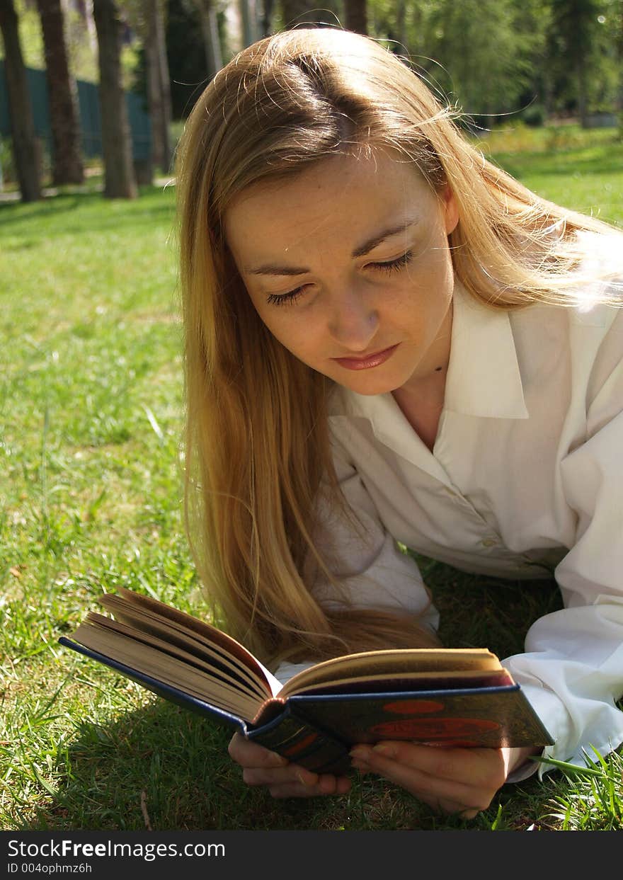 Woman reading on the grass