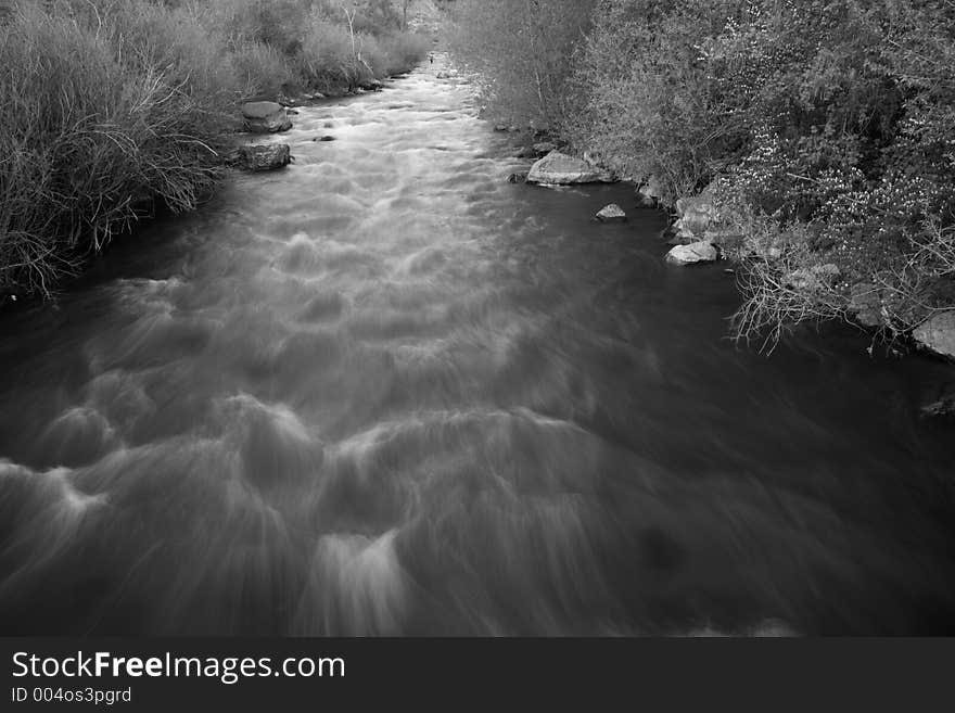 Smooth flow of a river or creek in the spring. Smooth flow of a river or creek in the spring