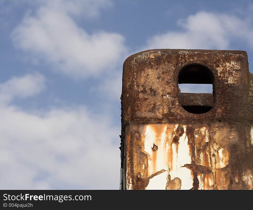 Rusty piece of metal with a nice sky background. Rusty piece of metal with a nice sky background