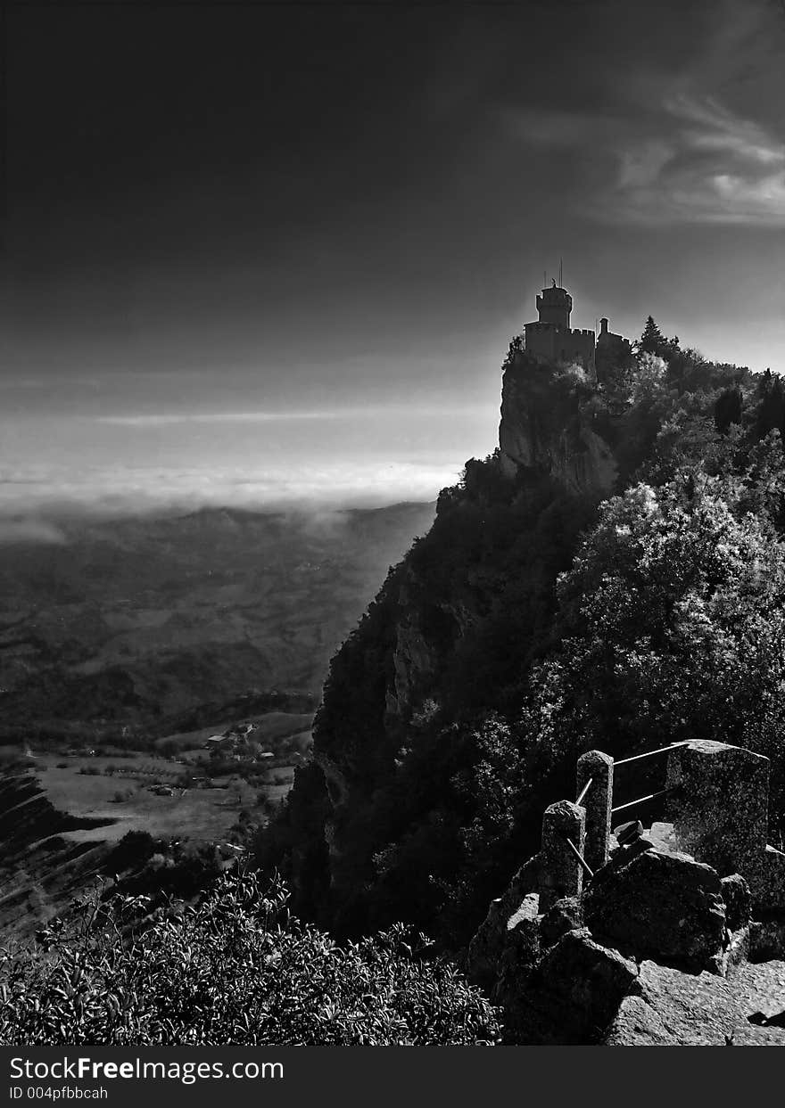 Medieval castle in San-Marino, Italy, BW version. Prepared to create impression of darkness and fear. Medieval castle in San-Marino, Italy, BW version. Prepared to create impression of darkness and fear.