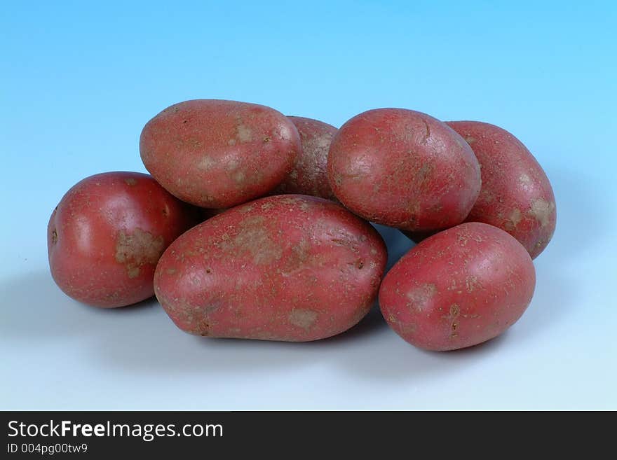 A studio image of a group of red potatoes