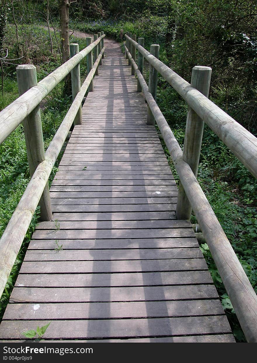 A wooden bridge constructed over a stream