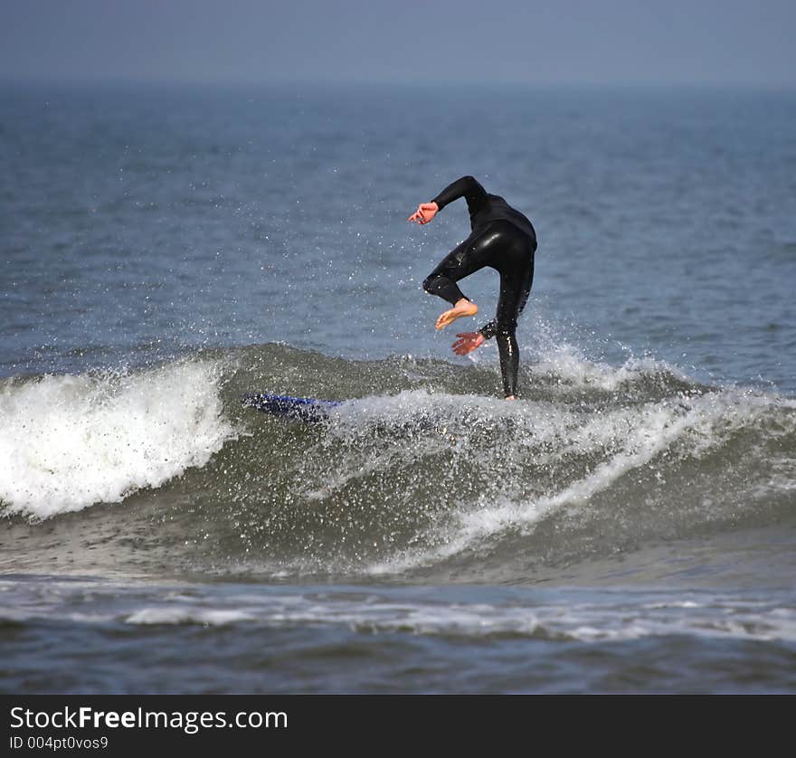 A bodyboarder rides a wave in Assateaque Island. Maryland. USA. A bodyboarder rides a wave in Assateaque Island. Maryland. USA