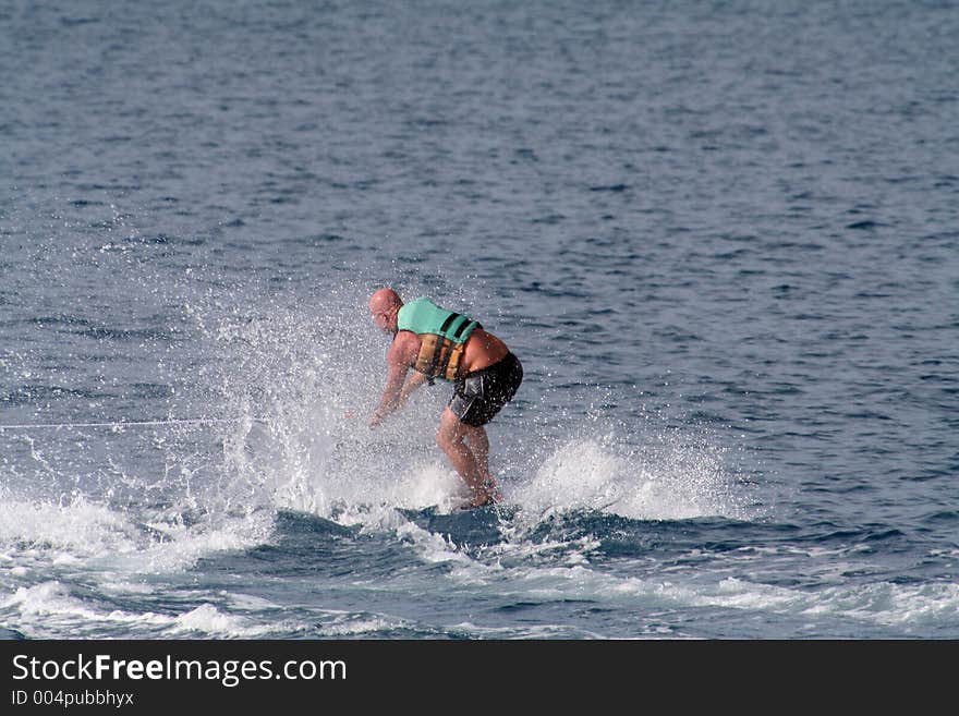 Beginner wakeboarder alone, with no boat showing