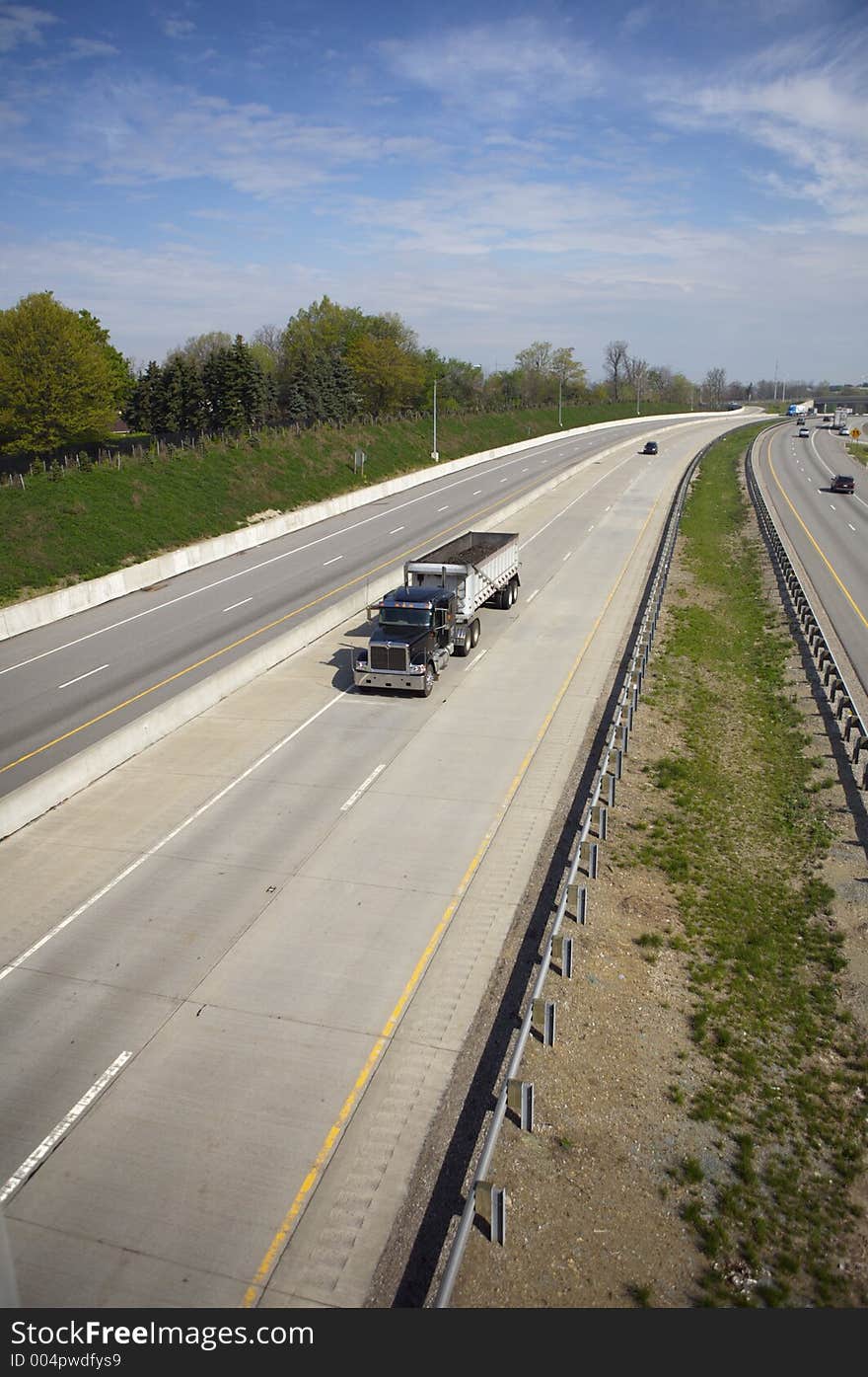 Semi Dump Truck on the highway with Copy Space (Wide Angle)