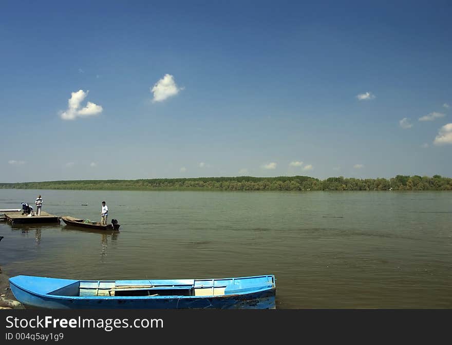 Scene on the river with blue sky in background. Scene on the river with blue sky in background