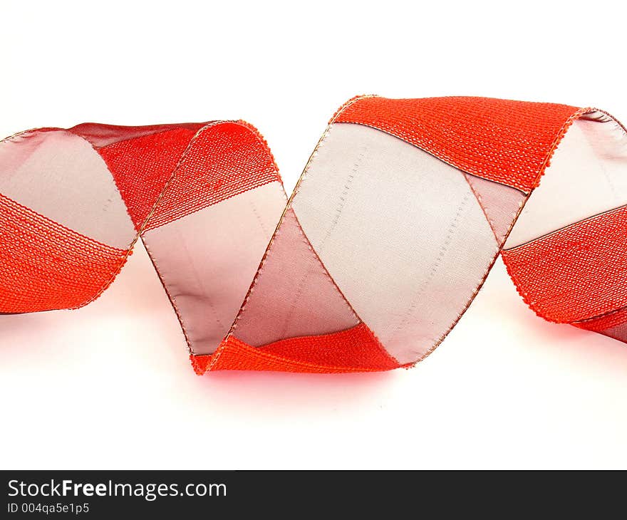 Red textile ribbon on white background. Red textile ribbon on white background