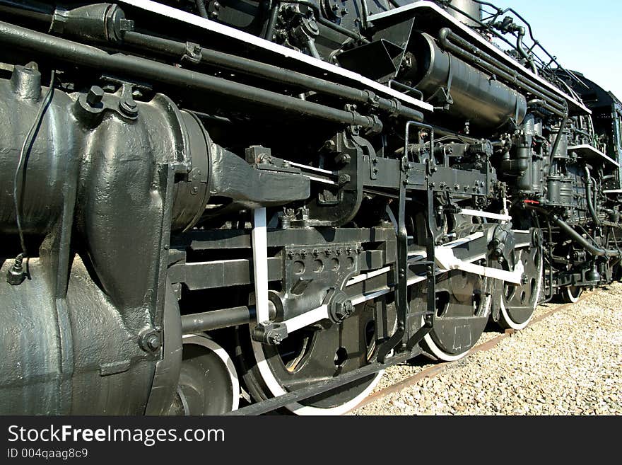 Close up view of wheels of vintage railroad steam locomotive. Close up view of wheels of vintage railroad steam locomotive